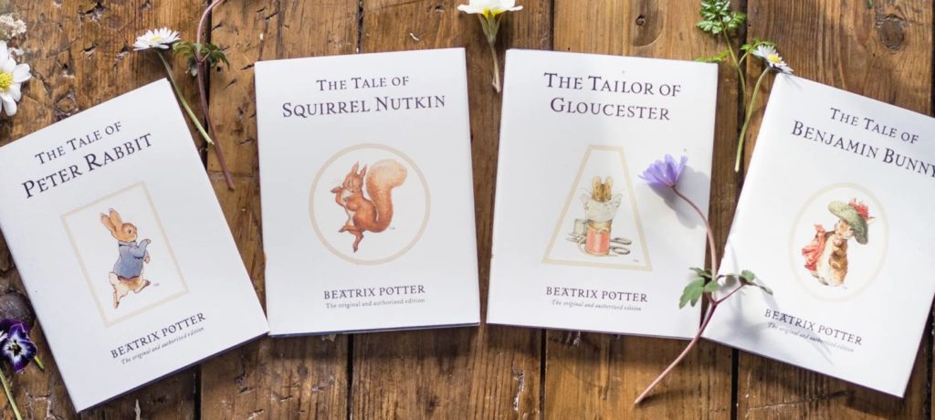 Background image of the classic Peter Rabbit Tales books that sits behind the shop element